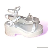 New No Box Size 9.5 White From Gb, The Wild-Child Leather Platform Sandals Feature: Leather Upper Buckle Closure Synthetic Lining Rubber Outsole Approx. 1.3" Platform Height Approx. 3.1" Heel Height Y2k Brats Chunky Strappy Lug Sole Leather All White