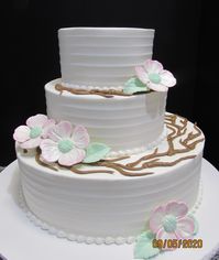 Custom made dogwood flowers on a three tier cake