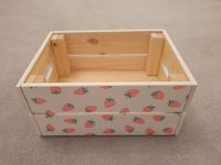 **Crate Dimensions once Assembled: Length: 31cm Width: 23cm Height: 14.5cm ** Wooden crate, hand painted in your choice of chalk paint and carefully covered in the popular Bright Strawberry print.  This beautiful crate can be used as toy/book storage brightening up a nursery or child's bedroom. Or to keep all of your baby's toiletries together in the nursery. It could also be used for storage else where in your home for beauty products or to keep the post neat and tidy.  This item is handmade to order, we put every effort into making each one to the highest standard. As each product is individually made there may be some slight variations.  Please note the items with the crate in the photo are not included in the sale. This beautiful crate will arrive with screws and full assembly instruct