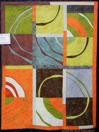 Ripple Effect II, 50 x 68", by Marianne Haak (Canada).  Modern Quilt Challenge, piecing award, improvisational curved piecing. Photo by Quilt Inspiration.  Link to tutorials.