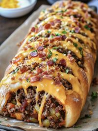 Garbage Bread is a delicious, savory stuffed bread loaded with all kinds of tasty fillings—think ground beef, gooey cheese, and vegetables all wrapped...