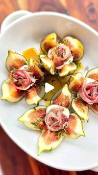 Kateryna Barger on Instagram: "(Recipe below) Oldie but goodie! Perfect appetizer or girl dinner? These baked figs are sure to impress!

You need:
- 4 large figs
- 4 balls of goat cheese, approximately 3/4 inch in diameter
- 2 slices of prosciutto, cut lengthwise in half, each half rolled
- 2 tbsp maple syrup
- 1 tsp fresh thyme, leaves only

Preheat the oven to 400F.  In a baking dish, place the figs. Make a fairly deep cross with a knife without cutting the bottom on the outside. Slide in the goat cheese balls, top with rolled prosciutto, drizzle with maple syrup, and sprinkle with thyme. Bake for 10 minutes. Enjoy!

For more ideas follow ⬇️ 
@katerynascafe 

#katerynascafe #figs #breakfast #brunch #appetizer  #eeeeeats #feedfeed #thekitchn #entertainingathome #easyrecipe #realsimple #vi