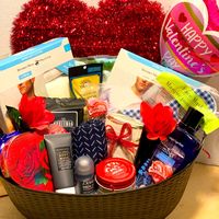 Men’s Valentine’s Day Gift Basket. Includes An Assortment Of T-Shirts And Crew Neck Tees. Body Wash/Lotion, Soaps, Mask, Antibacterial Wipes, Body Wipes, Candle, Chocolate And Candy. All Baskets Are Made To Order. Items May Vary. Balloons Are Not Included.