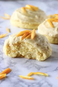 These Gluten-Free Vegan Orange Cookies are soft and chewy, slightly fluffy and perfectly citrusy! They're covered in a rich, creamy orange buttercream frosting too! A delicious sweet treat for Thanksgiving, Christmas, Easter, Mother's Day, bridal showers or baby showers. Dairy-free, egg-free and refined sugar free. #rhiansrecipes #vegan #glutenfree #dairyfree #orange #cookies #christmas