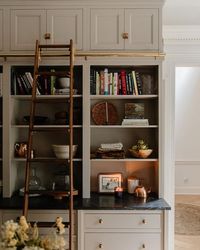 JULIA MARCUM · CLJ 🏡 on Instagram: "Slowly transitioning these shelves to match the season. Tip: it doesn't have to be so literal!! Here, I layered the kitchen shelves with thick napkins, old time-y candle holders, and wicker baskets makes it feel like fall around here. All from @walmart, I even color-matched the most perfect taupe taper candle, and I've been burning this warm "Leathered Amber" one all day. Bring on the apple cider. I'm rounding up all of the #Walmart sources on the @Shop.LTK