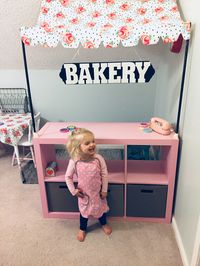 Easy DIY bakery for kids- fabric from hobby lobby, pvc pipe cut and spray painted black, cube organizer from Walmart