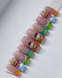 Elevate your nail game with a touch of nostalgia! Check out these hand-made Toy Story press-on nails, meticulously designed to bring your favorite movie to life. Perfect for adding a playful twist to any look, these press-ons are easy to apply and remove, offering both style and convenience. Embrace your inner child and let your nails become a part of the Toy Story adventure!  #ToyStoryNails #PressOnNails #HandMadeNails #NailArt #ToyStory #Woody #NailDesign #DIYNails #NailArtInspo