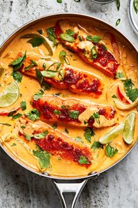 Bright herbs, creamy coconut curry broth, and juicy salmon make a flavorful addition to weeknight cooking in this coconut salmon curry recipe.