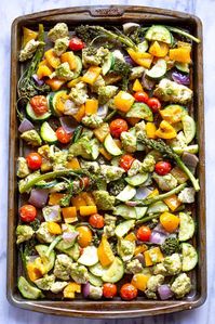 My favorite thing about this easy baked Pesto Chicken and Vegetables is that it's all made in one pan!   A healthy 30 minute meal for quick weeknight dinners.