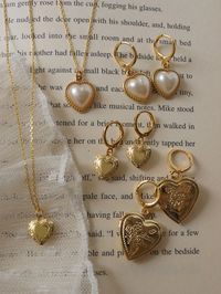 A romantic, fully functional heart locket necklace to be treasured; store little pictures of your loved ones and keep them close to your heart.  Gold base colour Gold chain: Gold plating over 925 Sterling Silver Heart locket charm: 18K Gold plating over copper   Measurements. Length 45cm. Heart locket 1cm by 1.1cm.