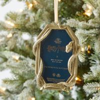 Decorate Your Tree In Hogwarts Style With The Magical Charm Of This Picture Frame Ornament, Featuring The Symbol Of Each Of The Slytherin House. Insert Your Favorite Photos Of Your Little Muggle, Witch Or Wizard For A More Personal Holiday Feel. Crafted Of Resin. Frame Ornament Has An Gold Finish. Features Hanging Ribbon. Personalization Is Embossed.