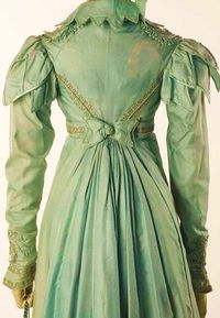 1820's.Petal caps on the sleeves, pointed scalloping on the collar,braid at the cuffs,shoulders and along the seams on the bodice. Love the color