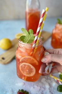 Summer in a glass is possible with this Strawberry Mint Lemonade! Fresh pureed strawberries are muddled with mint, then mixed with freshly squeezed lemonade - you can even turn this into a refreshing poolside cocktail by adding your favorite liquor!