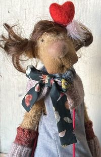 The "Sister Series" created exclusively for Earth Angels  here is a sweet "Little Sister"  Lo is an OOAK mohair bear dressed in a lovely bespoke outfit in fine fabrics by Liberty of London, and  with hand knit flourishes with a heart themed bag and decoration which matches her big sisters