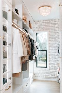 Chic and sophisticated: two words that come to mind when walking through @interiordesignerella custom walk-in closet. Jen was tired of her closet looking cluttered and chaotic, so she turned to Tailored Living to help her create the closet she's always wanted.