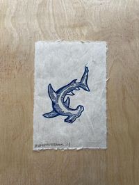 Handprinted linocut of a hammerhead shark, open edition. Paper is a handmade, textured lightweight mulberry and measures 4"x6".  All prints come signed. Due to the handprinted nature of relief printmaking, the print you receive may very ever so slightly from the print in the listing. Thank you for looking!