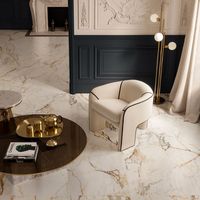 Divine Gold Italian tiles, inspired by Calacatta Oro marble, bring opulence and glamour with silky-smooth, polished finishes for a timeless look..#bathroommirror #bathroommarble #bathroomgoldaccents