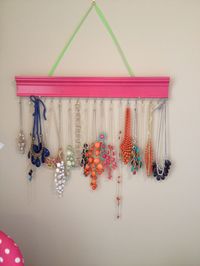 DIY necklace holder. made from crown molding and spray paint