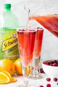 Orange Cranberry Spritzer - deliciously refreshing mocktail with Schweppes® Ginger Ale that's just as fancy as any cocktail. #mocktail #nonalcoholicdrink #partydrink #holidaypunch #spritzer