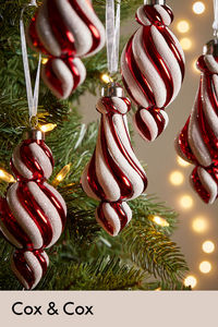 In a vibrant red and white stripe, these candy cane inspired baubles are the perfect addition to a traditional themed tree.

In a set of six, these baubles have a slightly unusual shape to them, adding a playful and quirky energy to your tree.