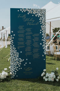 Free standing wedding seating chart adorned with hand picked connecticut oyster shells. Madison Beach Club ocean front backdrop for this stunner of a Installation and best ocean blue color. Photo: @stevedepino Planner: @acedevents Flowers: @flowersbyjustine