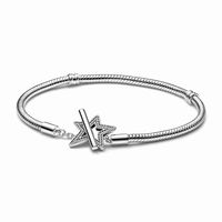 Our Pandora Moments Asymmetric Star T-bar Snake Chain Bracelet puts starry magic at the center of your styling. This celestial-inspired design features an asymmetric star T-bar clasp in polished sterling silver, carefully detailed by hand with rows of clear cubic zirconia pavé and a cut-out star in the center and featuring the engraved message "Make a wish." Inspired by the sparkle of the night sky, gift this special charm holder to a loved one as a reminder that organic, asymmetrical imperfecti