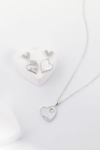 Our beautiful mother of pearl necklace and earrings make a perfect hearts jewelry set. Available in rose gold & silver.