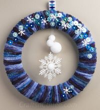 how to make an easy winter yarn wreath with snowflakes and snowballs