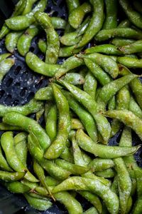 Another great snack idea, Air Fryer Roasted Edamame. This easy vegan air fryer recipe makes a wonderful healthy snack or appetizer. Fresh edamame roasted to perfection and served with a soy sesame dip. #airfryerrecipes #airfryer #veganrecipes #edamame