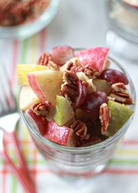 Autumn Fruit Salad with Cinnamon Greek Yogurt Dressing - crisp apples, sweet pears, and red grapes tossed with a creamy sweet dressing and topped with pecans.