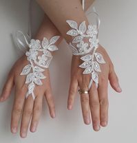 * Bridal accessories, bridal lace gloves. * Bridal gloves. * French lace fingerless gloves. Custom style. * Unusual and unique items.  *French lace gloves. * This model has been designed as the perfect accessory. * for a wedding to help French lace.  *Very stylish. an ideal design for beach wedding. * It's the perfect accessory for wedding photos. *Please contact us if you have any special requests. *Please contact me about the wedding date. Please contact me for fast shipment. Please fasten this connection for fast shipment. Please notify the phone number for quick shipment. https://www.etsy.com/listing/268980825/express-shipping-020?ref=shop_home_active_1