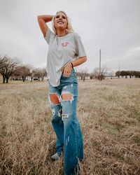 These distressed flare jeans are insanely rodeo chic! Our acid wash destroyed flare jeans are very true to size with no stretch, featuring distressed features and destroyed holes in both legs. We love pairing these with our favorite rodeo tees and turquoise jewelry for a fun look! Made in the USA! 33" inseam 83% Cotton 15% Polyester 2% Rayon