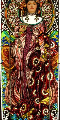 stained glass window by mark bogenrief | height 259cm | pendant to the contemplating lady | 'this is the full version of the champagne lady | it has over 8,000 pieces and jewels are swarovski | the art nouveau border is two layers of white glass fused together to give an elliptical effect'