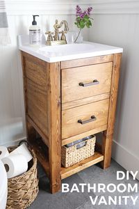 How to build a DIY bathroom vanity for $65! This DIY rustic bathroom vanity works great in small bathrooms, adds extra storage, is budget friendly, and looks cute too! Click to get the build plans and tutorial!