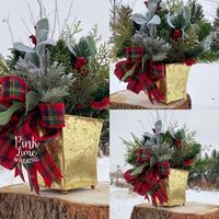 Winter centerpiece with a plaid bow, gold container, and evergreens. Put this out all winter long! Makes decorating easy. #pinklimewreaths #christmastabletopcenterpiece #winterarrangements #christmasdecor #christmastabledecoration #holidaycenterpiece #christmasflowerarrangement #fauxchristmasarrangements