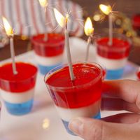 Your favorite kid treat (jello) got an adult makeover just in time for 4th of July. Get the boozy dessert at Delish.com. #delish #easy #recipe #vodka #jello #jelloshots #fourthofjuly #funshots #vodkajelloshots