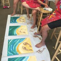 I found this awesome pin on Pinterest! It looks like an art studio painted white canvases and made a beach theme, painting beautiful water and sand. The kids painted their feet with brown paint and stamped it in the sand…how cool for a summer keepsake! I can just imagine younger kids doing it and having baby …