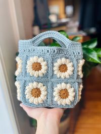 This crochet mini daisy tote bag pattern comes with both a pattern and tutorial with step by step pictures. These cute hand bags are the perfect addition to your summertime wardrobe!  Skill level: intermediate  I recommend certain colors in the pattern but you can substitute any colors to personalize it! This is a crochet PATTERN not the finished product, if you would like to buy a finished daisy bag, please look in my shop as I am also selling finished products! If you would like to purchase the finished product, please use the link below! https://www.etsy.com/listing/1448017893/small-crochet-tote-bag-flower-tote-mini This pattern is written in English only. This pattern only comes in a digital form. Do not sell this pattern or use any of the pictures for yourself. Feel free to sell small