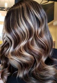 Save this pin for stunning brown hair with highlights you'll adore in 2024! Looking for lived-in caramel and blonde highlights? Tap to explore these gorgeous styles that add natural depth and dimension to your look.