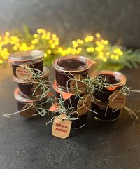 Eight glass jars of Hibiscus Chutney.