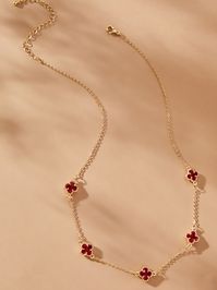 The color of love, power and courage all of which are present in this red and gold necklace. This striking red clover necklace empowers its wearer with five red clover charms all stationed on a dainty gold chain. This necklace is perfect to embellish any outfit or wear stacked with other necklaces.