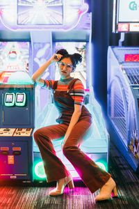 Arcade photoshoot. Arcade photography. Dave & Busters. Arcade lifestyle photoshoot. Space buns, corduroy overalls, glasses. @soy.la.princesa