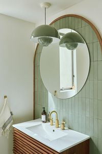 @ellmoredesign is redefining wall art. This modern arch in matte Zeppelin cement adorns this bathroom backsplash in @emilyandmeritt's new Los Angeles home.