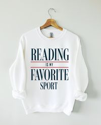 Hey Book lover, show off your love for Reading Books with our Reading is my favorite sport sweatshirt. The perfect gift for Readers, Librarians, Bookworms, Book Addicts, Book Nerds and Book Lovers.  All designs are available on tshirts/sweatshirts/hoodies. Send me a message if you can't find the product you need! MATERIAL ✨ Sweatshirt sizes are Unisex, please refer to sizing chart in listing photos ✨ 50% cotton, 50% polyester ✨ Medium fabric weight ✨ DTG Printed CARE ✨ Machine wash: warm (max 40