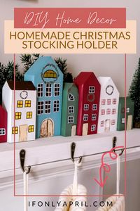 This year I decided to update our Christmas stockings holders and make a new set. I settled on a DIY Christmas village wooden stocking holder. It reminds me a bit of last year's advent village that I made from cardboard but this year we took it up a notch. It is screwed to the board so it's not moving around. | stocking holder | christmas stocking holder | home decoration dyi | wooden christmas stocking holder | home christmas decor | holiday decor christmas | santa stocking