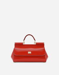 Elongated Sicily bag in shiny calfskin: Red Front flap with hidden double magnetic fastening Logo tag featuring two metal plating finishes Top handle and adjustable, detachable strap in polished calfskin Printed fabric lining and flat pocket Item comes with a branded dust bag Measurements: H18 x W29 x D10 cm Made in Italy