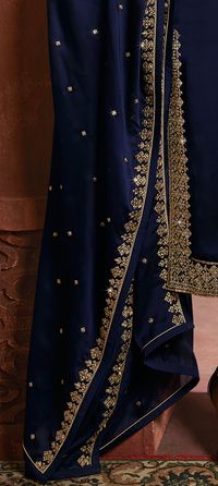 COLOR : Navy Blue FABRIC : Top - Silk, Bottom - Silk Lehenga & Santoon Pants, Dupatta - Silk WORK : Resham & Zari Embroidery, Hand Work, Stones, Sequins, Motifs, Lace Border OCCASION : Wedding, Reception, Party Wear, Festival ADDITIONAL INFO : The outfit comes with complimentary santoon pants besides the lehenga. READY-TO-WEAR : No STITCHING : Available as semi-stitched fabric, can be stitched using standard size option (+$30). Note: There might be a slight color variation due to lighting and fl