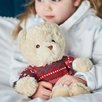 The 'Warmies 13' Microwaveable Christmas Jumper Bear encapsulates the essence of comfort and warmth, just like all Warmies®. These luxuriously soft plush designs, scented with relaxing lavender, are fully heatable soft toys that bring hours of soothing warmth and comfort. With their weighted, warming, and super cuddly features, the 'Warmies 13' Microwaveable Christmas Jumper Bear stands as an ideal gift suitable for all ages, providing the joy of reheatable coziness time and time again