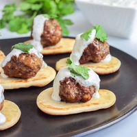 These lamb meatballs are one of my favorite party appetizers! They are moist, juicy and packed with delicious mediterranean seasonings. Serve them with mini toothpicks and a creamy tzatziki sauce, and your guests will be raving.