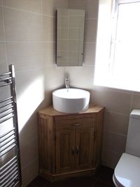 Corner basin units are ideal for en-suites and smaller bathrooms. More